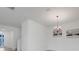 Bright dining area with modern chandelier, neutral wall colors, and an open floor plan at 2025 Axel St, Minneola, FL 34715