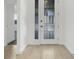 Welcoming entryway with modern double doors, neutral floor tiles, and clean, bright finishes at 2025 Axel St, Minneola, FL 34715