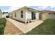 Cozy back patio area with awning, perfect for relaxing and enjoying the outdoors at 2050 Duval Ct, The Villages, FL 32162