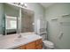 Bathroom featuring a single sink vanity, toilet, and a glass enclosed tiled shower at 2050 Duval Ct, The Villages, FL 32162