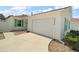Charming single-story home with attached garage, green shutters, and well-manicured landscaping at 2050 Duval Ct, The Villages, FL 32162