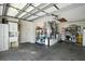 Spacious garage with sink, storage cabinets, and additional room for workshop area at 2050 Duval Ct, The Villages, FL 32162