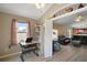 Inviting living area flows into the kitchen, offering an open and airy space with vaulted ceilings at 2050 Duval Ct, The Villages, FL 32162