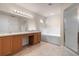 Bright bathroom with dual sink vanity, soaking tub, and glass enclosed shower at 211 Highland Meadows Ct, Davenport, FL 33837