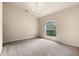 Bedroom with carpet and a window view at 211 Highland Meadows Ct, Davenport, FL 33837