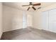 Bedroom featuring carpet, ceiling fan and closet at 211 Highland Meadows Ct, Davenport, FL 33837