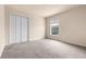 Neutral bedroom featuring a large closet and a window letting in natural light at 211 Highland Meadows Ct, Davenport, FL 33837