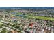 Aerial view of community with golf course and lakes at 2111 Thornton Ter, The Villages, FL 32162