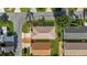 Aerial shot of house, showcasing roof, driveway, and lawn at 2111 Thornton Ter, The Villages, FL 32162