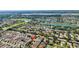 Aerial view of neighborhood featuring well manicured landscapes and mature trees at 2111 Thornton Ter, The Villages, FL 32162