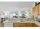 Open concept kitchen with a view into the living and dining areas at 2111 Thornton Ter, The Villages, FL 32162
