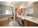 Elegant bathroom features a double vanity, shower and tub, with nice finishes at 21206 Canoe Pass St, Clermont, FL 34715