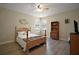 Bedroom featuring a wood bed frame and a bookshelf with 2 windows allowing for natural light at 21206 Canoe Pass St, Clermont, FL 34715