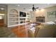 Spacious living room boasts a fireplace, large built-ins, and luxury finishes at 21206 Canoe Pass St, Clermont, FL 34715