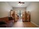 Living room with a decorative divider, and view to the front yard at 21206 Canoe Pass St, Clermont, FL 34715