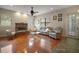 Large living room boasts a fireplace, luxury finishes, and access to the back yard at 21206 Canoe Pass St, Clermont, FL 34715