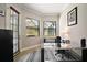 Bright home office with two large windows providing lots of natural light and views to the exterior at 21206 Canoe Pass St, Clermont, FL 34715