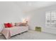 Bright bedroom with a decorative surfboard and cozy daybed near shuttered window at 2321 Demarco Dr, The Villages, FL 32163