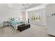 Bright bedroom featuring a ceiling fan, neutral carpeting, and shutters at 2321 Demarco Dr, The Villages, FL 32163