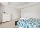 Bedroom featuring a tray ceiling, neutral carpet, and ample natural light at 2321 Demarco Dr, The Villages, FL 32163