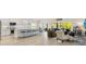 Open-concept living space featuring modern kitchen, a large center island, and adjacent Gathering room at 2321 Demarco Dr, The Villages, FL 32163