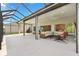 The covered patio has ample space for outdoor entertaining and seamless flow between indoor and outdoor living at 2321 Demarco Dr, The Villages, FL 32163