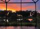 Enjoy stunning sunset views over the pond and trees from the comfort of your screened-in patio at 2321 Demarco Dr, The Villages, FL 32163