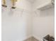 Bright walk-in closet featuring white wire shelving and neutral carpet at 2321 Demarco Dr, The Villages, FL 32163