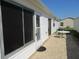 Back patio with ample space for entertaining, showcasing the outdoor living area and backyard at 2388 Branchville Ter, The Villages, FL 32162