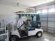 Spacious garage featuring a golf cart and ample room for storage and other equipment at 2388 Branchville Ter, The Villages, FL 32162