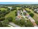 Elevated view of homes nestled in a mature tree community near a creek and golf course at 25236 Waterbridge Ct, Leesburg, FL 34748