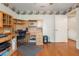 Versatile room with wooden floors, ceiling fan, and wooden desk unit at 25236 Waterbridge Ct, Leesburg, FL 34748