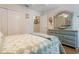 Bright bedroom with wood floors, a ceiling fan, and a matching dresser and mirror at 25236 Waterbridge Ct, Leesburg, FL 34748
