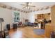 Versatile room with wooden floors, ceiling fan, and window with natural light at 25236 Waterbridge Ct, Leesburg, FL 34748