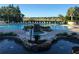 Community pool with plenty of lounge chairs and lush landscaping is the perfect place to relax and cool off at 25236 Waterbridge Ct, Leesburg, FL 34748