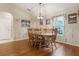 Traditional dining room with hardwood floors, a chandelier, and plenty of space for entertaining at 25236 Waterbridge Ct, Leesburg, FL 34748