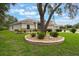 Charming home features a well-manicured lawn and lush landscaping, enhancing its curb appeal at 25236 Waterbridge Ct, Leesburg, FL 34748