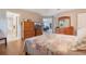 Spacious main bedroom with hardwood floors and access to the ensuite bath and outdoor patio at 25236 Waterbridge Ct, Leesburg, FL 34748