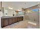 Bathroom featuring double vanity, large mirror, and frameless glass shower at 2666 Meadowedge Loop, St Cloud, FL 34772