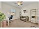 Inviting bedroom space featuring neutral tones, comfortable seating, and bright natural light at 2666 Meadowedge Loop, St Cloud, FL 34772