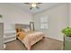 Cozy bedroom featuring a ceiling fan, and a window providing natural light at 2666 Meadowedge Loop, St Cloud, FL 34772