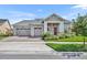 Charming single-story home featuring a three-car garage, well-manicured lawn, and inviting entryway at 2666 Meadowedge Loop, St Cloud, FL 34772