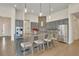 Open kitchen featuring a large island with seating, stainless steel appliances, and granite countertops at 2666 Meadowedge Loop, St Cloud, FL 34772
