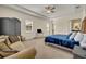 Main bedroom with carpet, a seating area, and ensuite bathroom at 2666 Meadowedge Loop, St Cloud, FL 34772