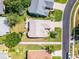 Overhead view of home and backyard showing a landscaped yard and adjacent neighborhood street for a serene and inviting outdoor space at 27018 Nature View St, Leesburg, FL 34748