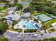 Overhead image displaying community's resort-style pool and tennis courts surrounded by well-maintained grounds for active lifestyles at 27018 Nature View St, Leesburg, FL 34748