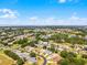 Panoramic aerial shot displays community, its homes, lake, and natural surroundings, emphasizing the area's peacefulness and picturesque scenery at 27018 Nature View St, Leesburg, FL 34748