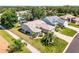 Beautiful home with manicured landscaping and a well-maintained lawn, surrounded by lush greenery at 27018 Nature View St, Leesburg, FL 34748