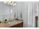 The bathroom has a vanity, framed mirror, and neutral walls for a peaceful and relaxing experience at 27018 Nature View St, Leesburg, FL 34748