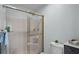 The bathroom features a toilet and glass-enclosed shower for your convenience and comfort at 27018 Nature View St, Leesburg, FL 34748